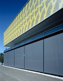 Reifen Fischer - detail of facade with closed shutters