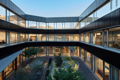 Headquarter Berger Logistik - courtyard at night