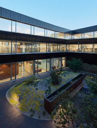 Headquarter Berger Logistik - courtyard at night